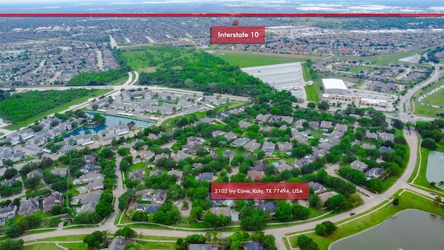 aerial view of property's location with a large body of water