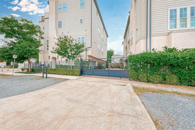 5101 Allen St, Houston, TX 77007 - view of concrete driveway featuring a gated entry