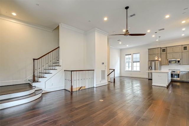5101 Allen St, Houston, TX 77007 - unfurnished living room featuring crown molding, ceiling fan, dark wood finished floors, recessed lighting, and baseboards