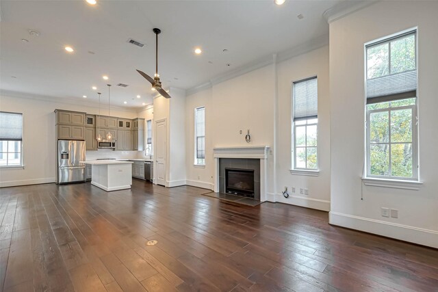 5101 Allen St, Houston, TX 77007 - unfurnished living room with ornamental molding, ceiling fan, baseboards, a tile fireplace, and dark wood finished floors