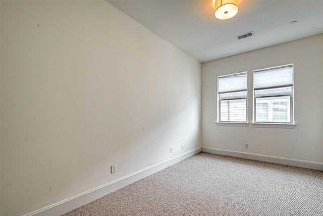 5101 Allen St, Houston, TX 77007 - spare room featuring baseboards and light carpet