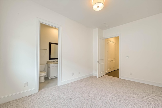 5101 Allen St, Houston, TX 77007 - unfurnished bedroom featuring light colored carpet, baseboards, a sink, and ensuite bathroom