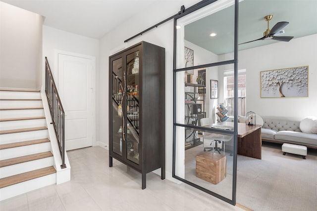 4504 Yupon St, Houston, TX 77006 - entrance foyer featuring stairs, ceiling fan, a barn door, and recessed lighting