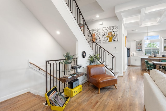 4504 Yupon St, Houston, TX 77006 - staircase featuring wood finished floors, recessed lighting, baseboards, coffered ceiling, and beam ceiling