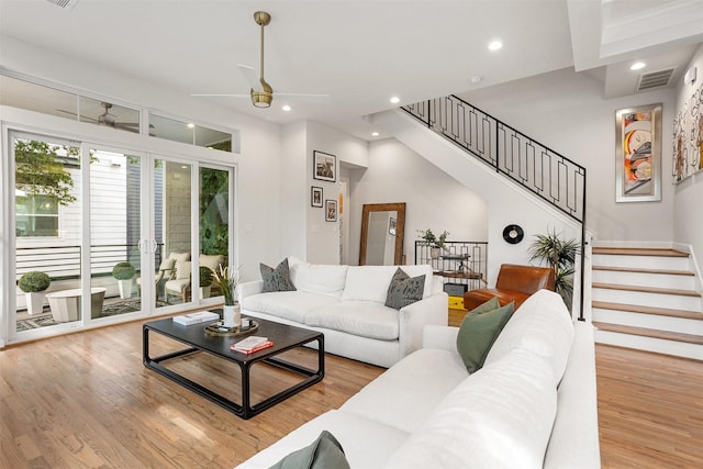 4504 Yupon St, Houston, TX 77006 - living area featuring ceiling fan, stairs, light wood-type flooring, and recessed lighting
