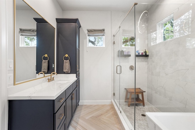 4504 Yupon St, Houston, TX 77006 - bathroom with vanity, a shower stall, a freestanding tub, and baseboards