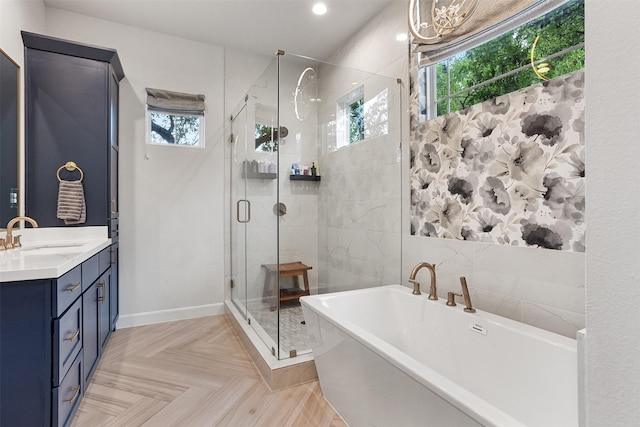 4504 Yupon St, Houston, TX 77006 - bathroom featuring a soaking tub, a stall shower, vanity, recessed lighting, and baseboards