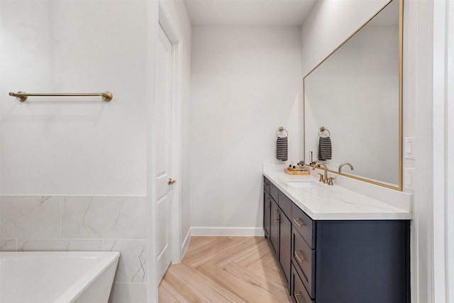 4504 Yupon St, Houston, TX 77006 - full bathroom with a freestanding bath, vanity, tile walls, and a wainscoted wall