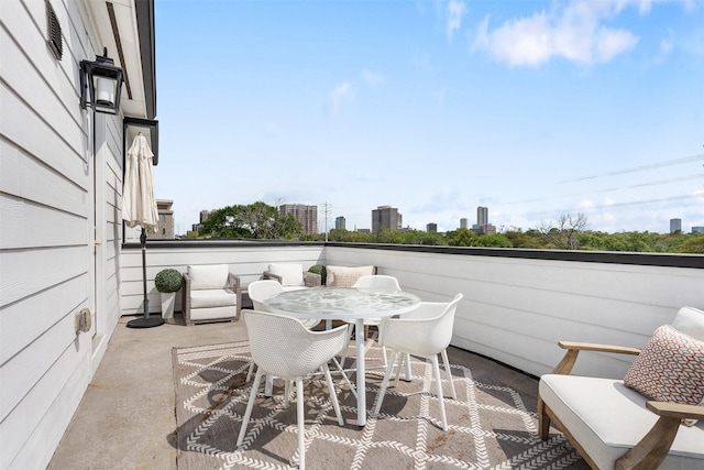 4504 Yupon St, Houston, TX 77006 - view of patio / terrace featuring a city view and outdoor dining area