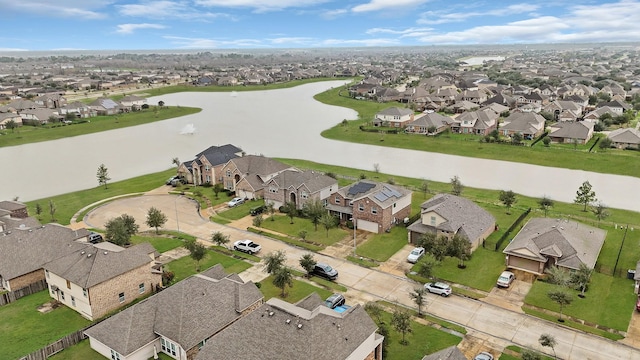 aerial view with a water view and a residential view