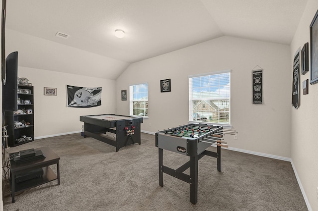 recreation room featuring carpet flooring, baseboards, vaulted ceiling, and visible vents