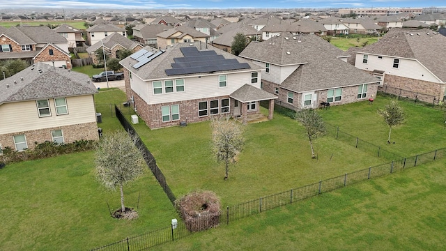 birds eye view of property with a residential view