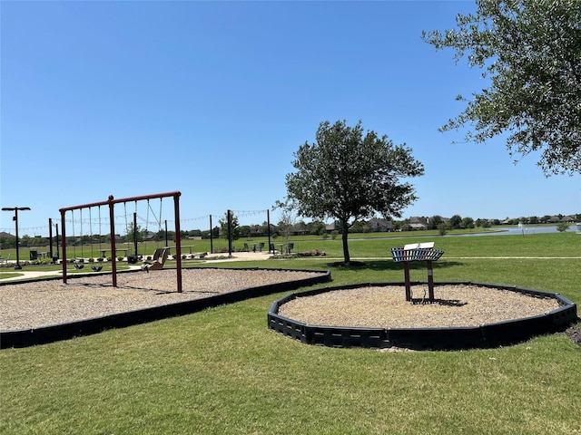 community jungle gym with a yard