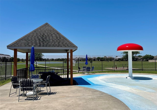 view of home's community featuring a patio area, a gazebo, and fence