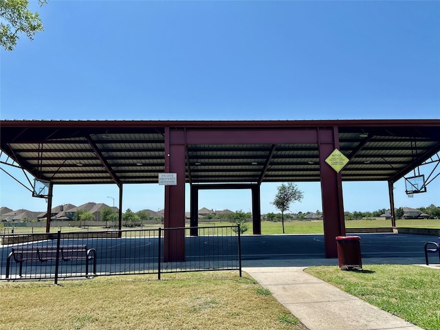 surrounding community featuring fence and a lawn