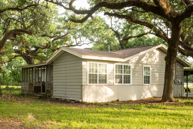 447 Fm 2540 N, Van Vleck, TX 77482 - view of side of home with a sunroom and a yard