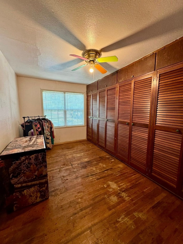 447 Fm 2540 N, Van Vleck, TX 77482 - bedroom with hardwood / wood-style floors, a textured ceiling, and ceiling fan