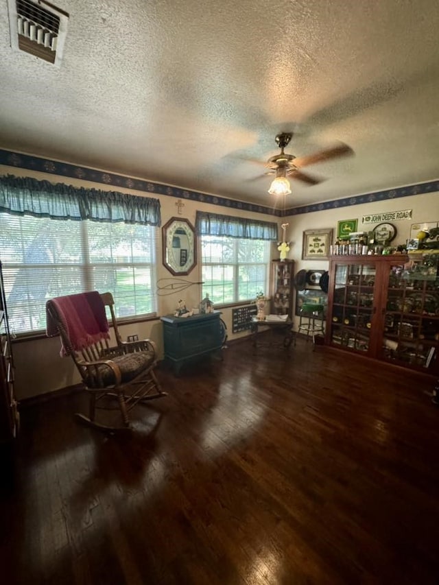 447 Fm 2540 N, Van Vleck, TX 77482 - sitting room with a textured ceiling, ceiling fan, and hardwood / wood-style flooring