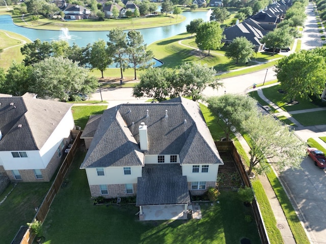 aerial perspective of suburban area with a nearby body of water