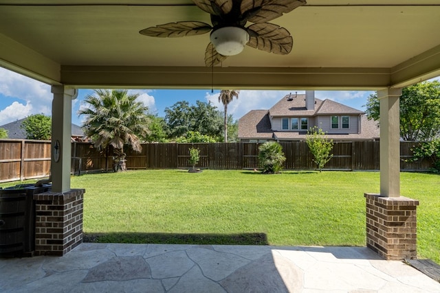 view of yard featuring a patio and ceiling fan