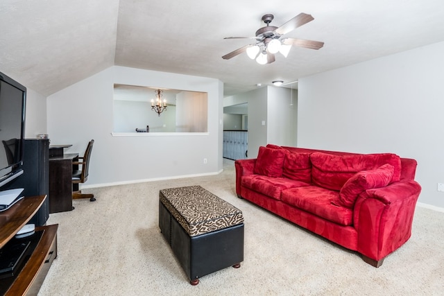 carpeted living room with a chandelier, a ceiling fan, baseboards, lofted ceiling, and a desk