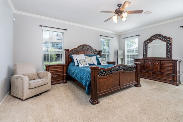 bedroom featuring light carpet, crown molding, ceiling fan, and baseboards