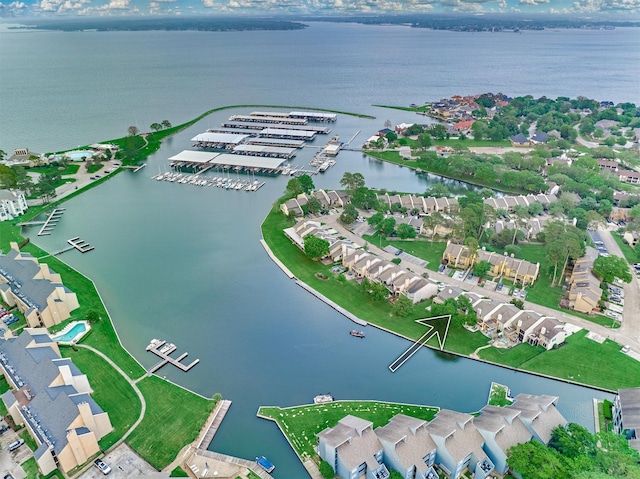 drone / aerial view with a water view and a residential view