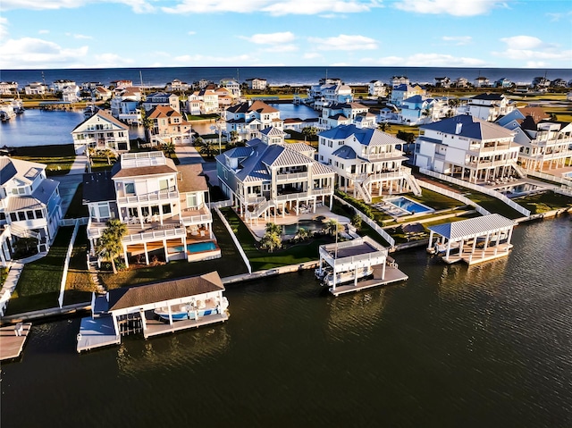 20710 E Sunset Bay Dr, Galveston, TX 77554 - birds eye view of property with a water view and a residential view