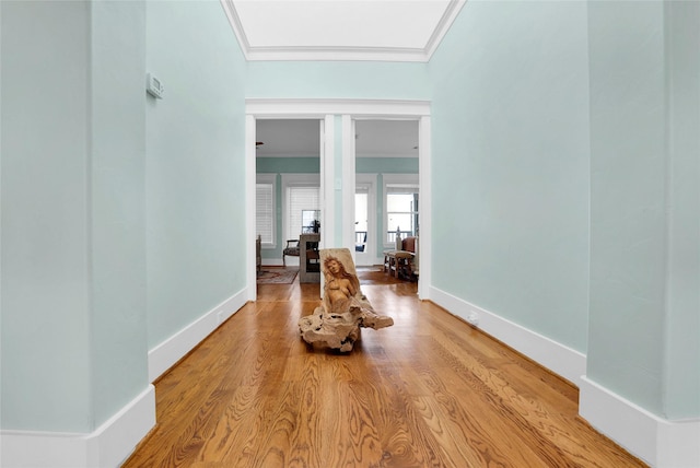 20710 E Sunset Bay Dr, Galveston, TX 77554 - corridor with baseboards, wood finished floors, and crown molding