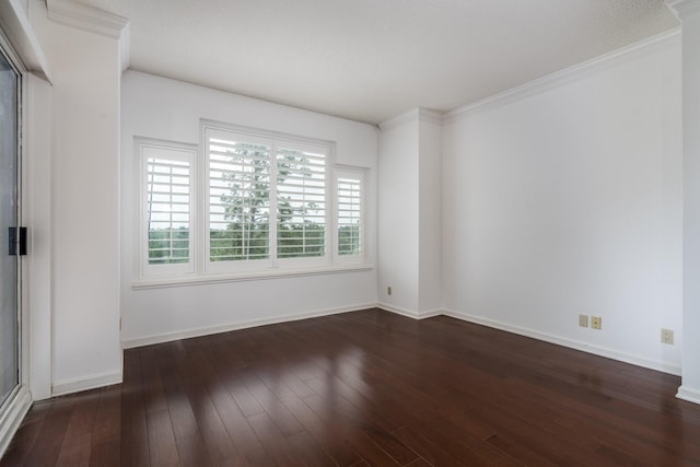 150 Gessner Rd Unit 7D, Houston, TX 77024 - spare room featuring dark wood finished floors, baseboards, and crown molding