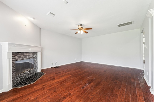 unfurnished living room featuring visible vents, ceiling fan, wood finished floors, and a fireplace