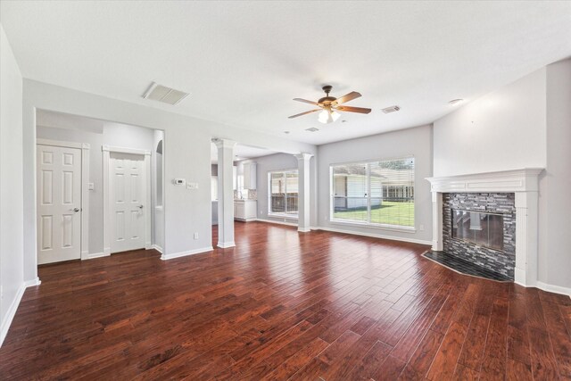 unfurnished living room featuring wood finished floors, a ceiling fan, visible vents, and baseboards