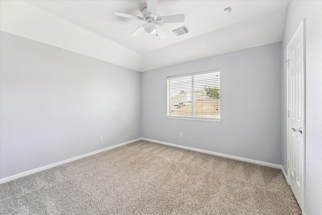 unfurnished room featuring baseboards, visible vents, a ceiling fan, and light carpet