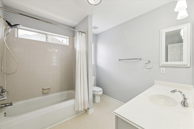 full bathroom featuring tile patterned flooring, shower / bathtub combination with curtain, toilet, vanity, and baseboards