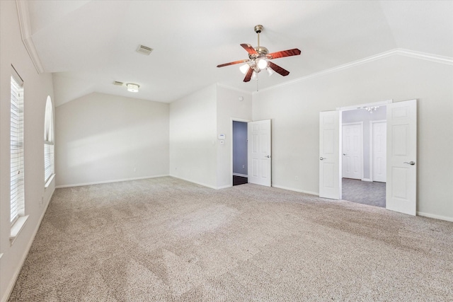 interior space with multiple windows, vaulted ceiling, and visible vents