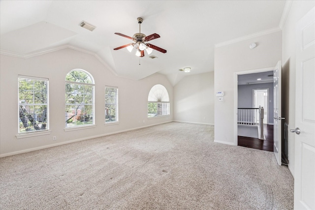 interior space featuring a ceiling fan, visible vents, carpet, and plenty of natural light