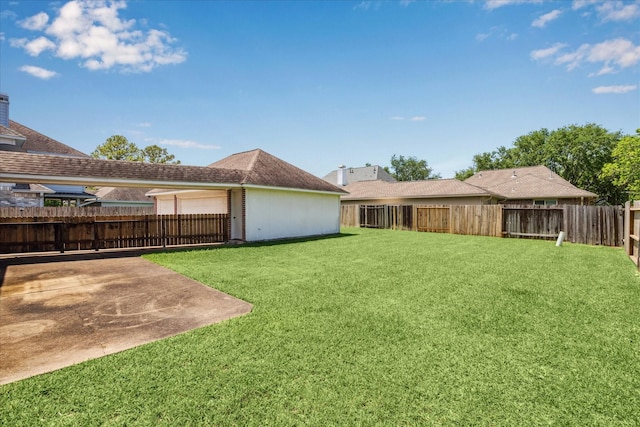 view of yard featuring a patio area and a fenced backyard