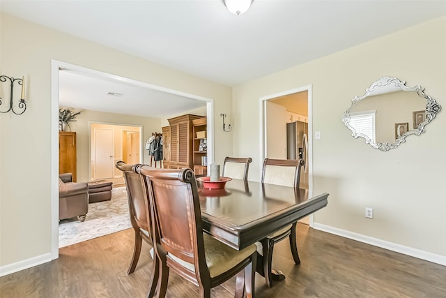 18210 Point Lookout Dr, Houston, TX 77058 - dining room with wood finished floors and baseboards
