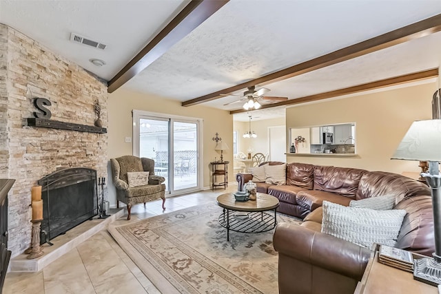 18210 Point Lookout Dr, Houston, TX 77058 - living room with beam ceiling, a ceiling fan, and a stone fireplace