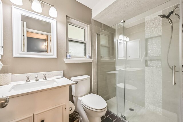 18210 Point Lookout Dr, Houston, TX 77058 - bathroom with a shower stall, toilet, vanity, and tile patterned floors