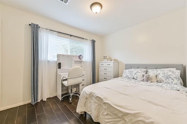 18210 Point Lookout Dr, Houston, TX 77058 - bedroom featuring baseboards, an office area, and wood finish floors