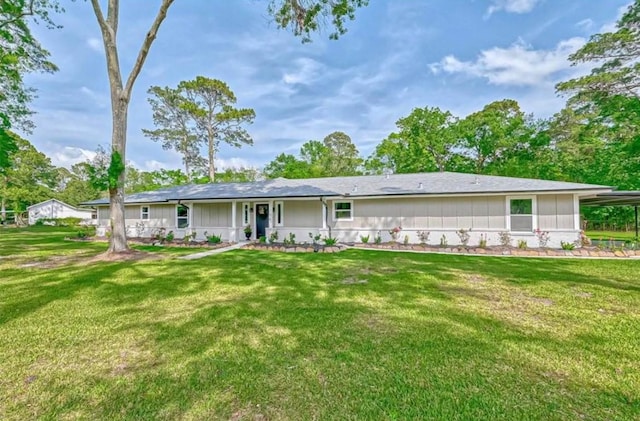 back of property with a yard