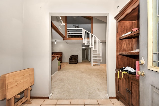 3810 Peters San Felipe Rd, Sealy, TX 77474 - entrance foyer with tile patterned floors, carpet flooring, baseboards, and stairway