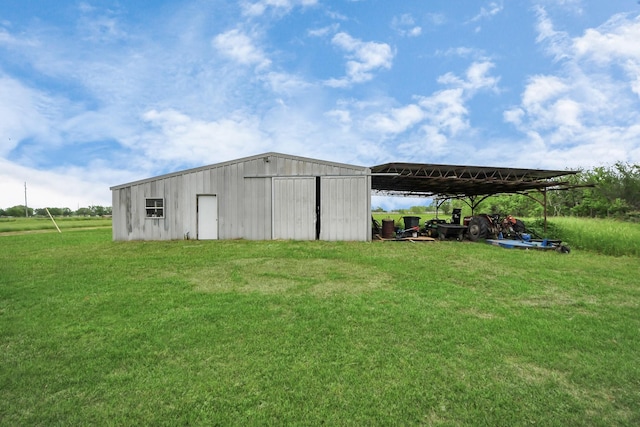 3810 Peters San Felipe Rd, Sealy, TX 77474 - view of pole building with a carport and a yard