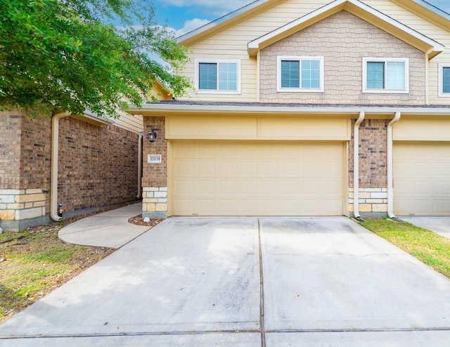17035 Wilthorne Gardens Ct, Houston, TX 77084 - view of front of home with brick siding, driveway, and a garage