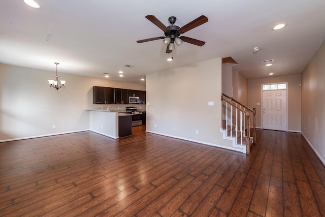 17035 Wilthorne Gardens Ct, Houston, TX 77084 - unfurnished living room with recessed lighting, stairway, dark wood-style floors, baseboards, and ceiling fan with notable chandelier