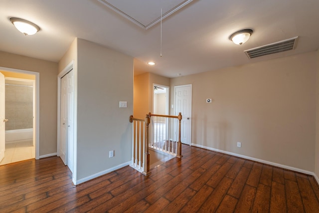 17035 Wilthorne Gardens Ct, Houston, TX 77084 - unfurnished room with attic access, baseboards, visible vents, and wood-type flooring