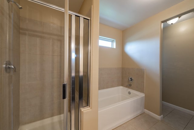 17035 Wilthorne Gardens Ct, Houston, TX 77084 - bathroom with a bath, tile patterned flooring, and a stall shower