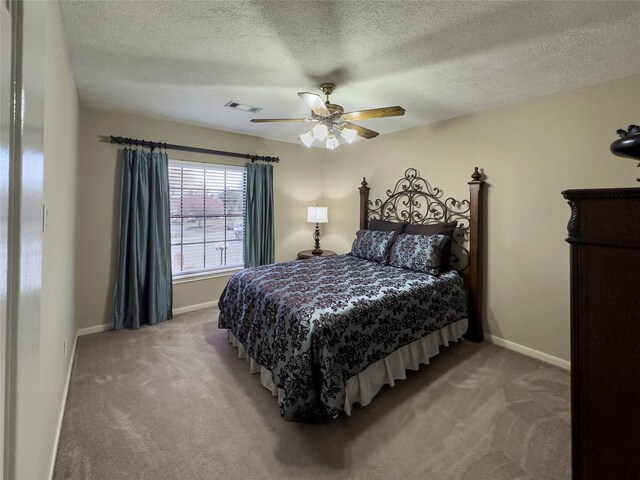 2202 Canterbury Ct, Deer Park, TX 77536 - bedroom featuring carpet floors, baseboards, a textured ceiling, and a ceiling fan