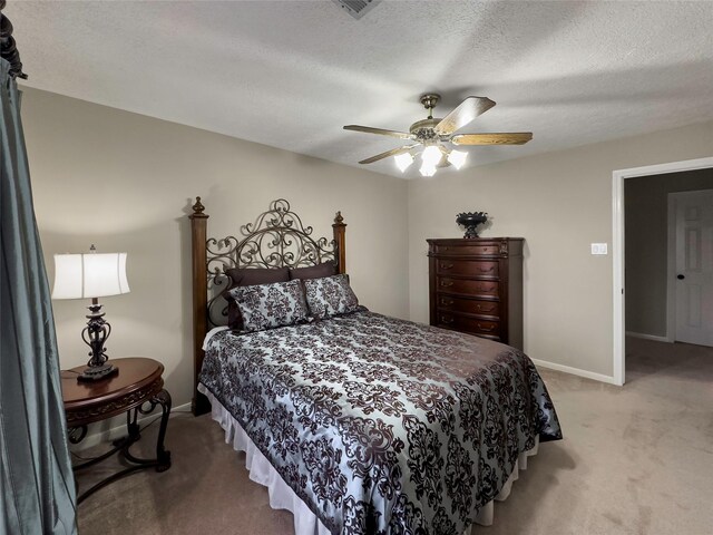 2202 Canterbury Ct, Deer Park, TX 77536 - bedroom featuring light colored carpet, baseboards, ceiling fan, and a textured ceiling